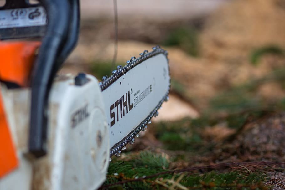 Chainsaw being used for outdoor wood cutting